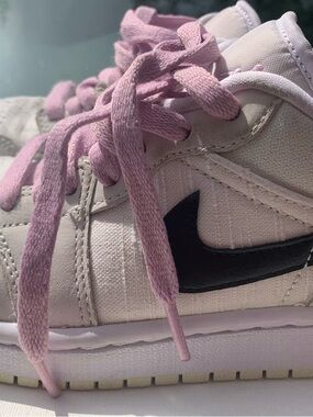 Nike Kids Pink Low-Top Sneakers with Black Swoosh